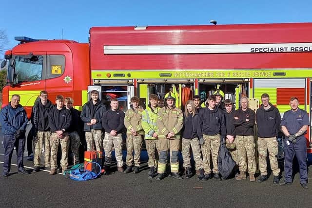 The students with Nottinghamshire Fire and Rescue's engine