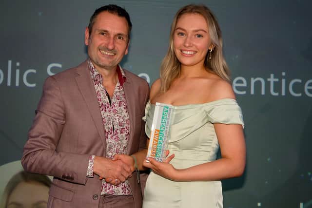 Phil Bramley presents winner Erin Cunningham - Burley with the health and public service award at the Derbyshire and Nottinghamshire Apprenticeship Awards 2022