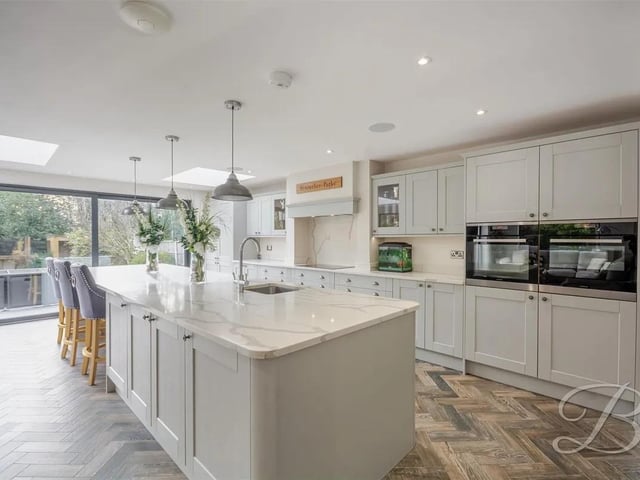 This impressive space showcases open-plan living at its finest, seamlessly blending style and functionality.