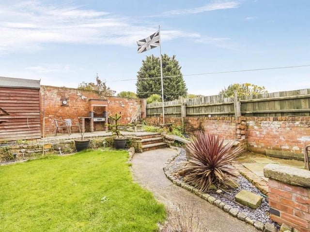 Let's fly the flag for this lovely, split-level garden at the back of the Kimberley property. It has a patio area, a lawn, a brick barbecue and a garden shed.