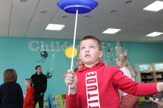 Plate spinning was just one of the circus skills to try. Here is Caedyn Goucher giving it a go.