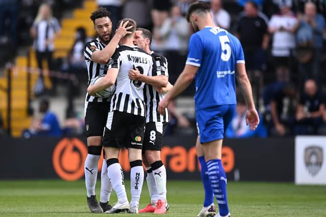 Stags loanee Jimmy Knowles celebrates a Notts goal with Kyle Wootton and Michael Doyle.