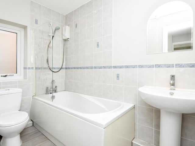 The family bathroom also sits on the first floor. It is compact but contains a bath, wash hand basin and low-flush WC