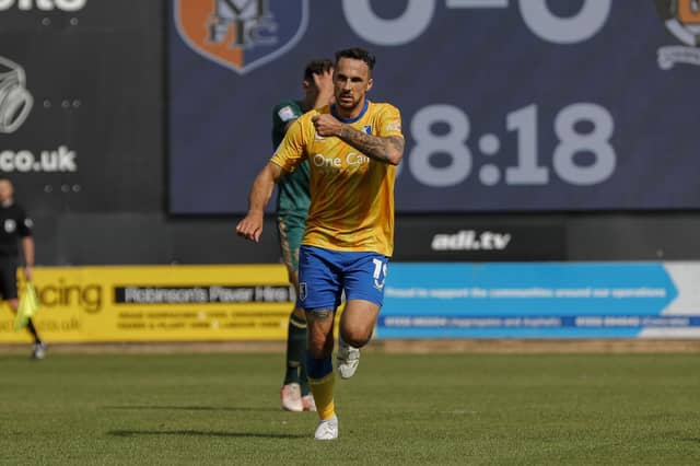 Lee Gregory scores against Cambridge United last season. Photo by Chris & Jeanette Holloway / The Bigger Picture.media