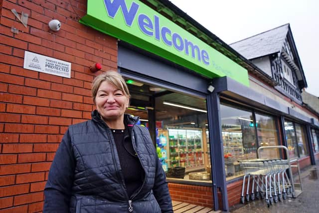 Donna Hall, the store manager, is all smiles on the opening morning.