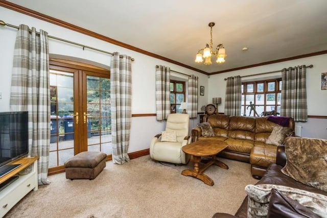 The lounge or living room is a very good size and both relaxing and comfortable. There is a bay window to the front of the property, while patio doors lead to the side garden.