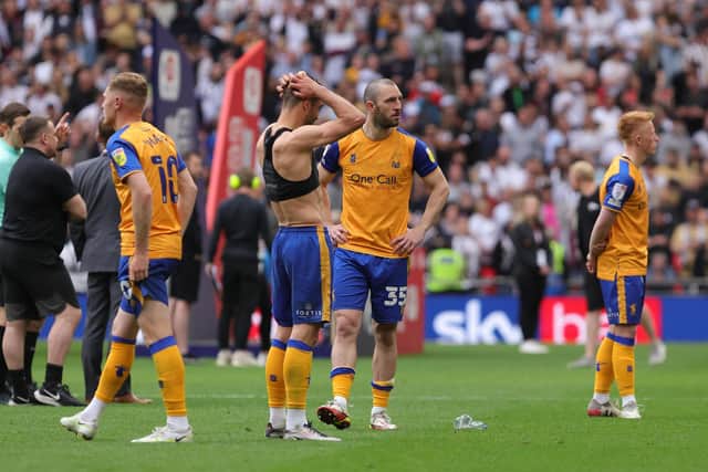 Stags players are heartbroken at the final whistle.