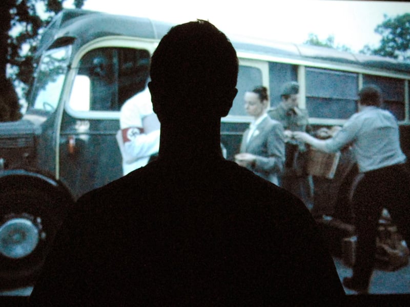 A visitor watches the new art film documentary Resistance at The Old Library Mansfield, 2010.