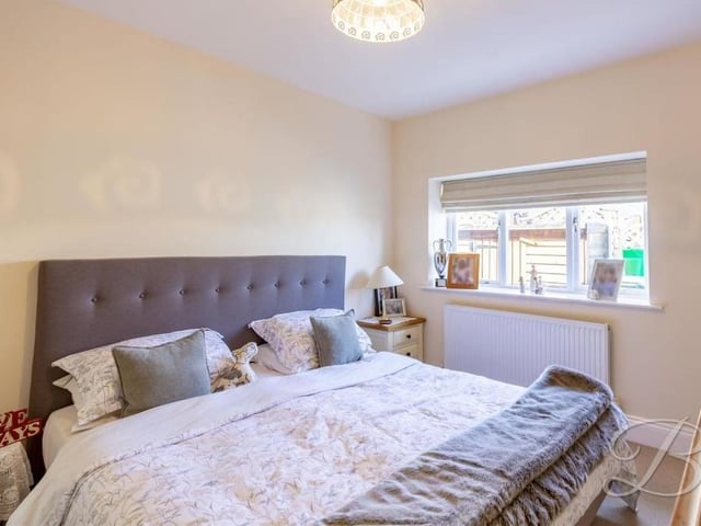 The second bedroom might be smaller than the master, but it is still a good size. It features fitted wardrobes, a carpeted floor and double windows to the front of the property.