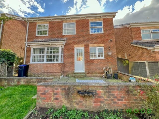Let's take a look outside now, and here is a view of the rear of the £285,000-plus property. A patio area leads on to the main garden.