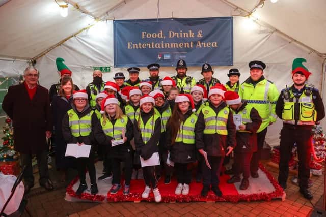 Youngsters in the Mini Police Cadet force and Nottinghamshire Police help entertain shoppers in Mansfield with festive carol concert.