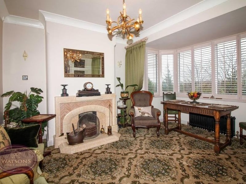 The dining room from a different angle. It has a homely, traditional feel to it, especially with its feature fireplace.