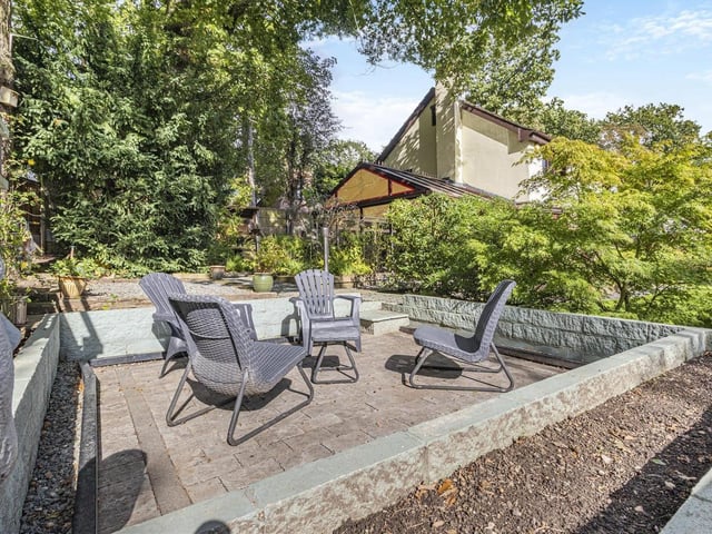 This sunken, block-paved patio is a veritable sun trap, making it the perfect spot for a seating area.