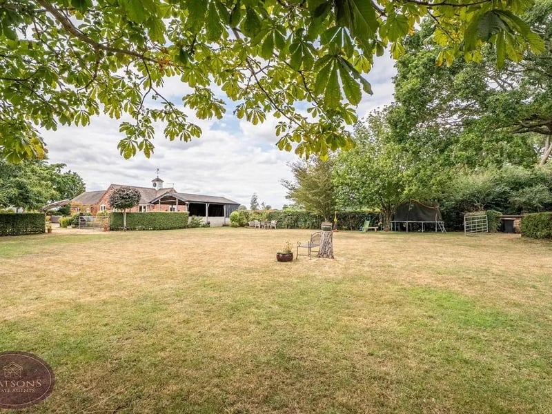 Beyond the formal gardens lies an impressive collection of lifestyle and smallholding facilities, including a stable block, livestock pens, greenhouse, vegetable plots, fruit orchard and two paddocks.