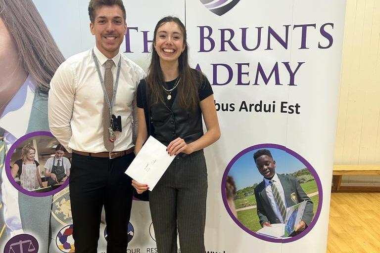 Proud pupil Mia Hagues earned grade 9s in English language and literature, history, media studies and physics; 8s in biology, chemistry, French and maths; and a 6 in psychology. She is pictured with head of key stage three Josh Morris at The Brunts Academy this morning.