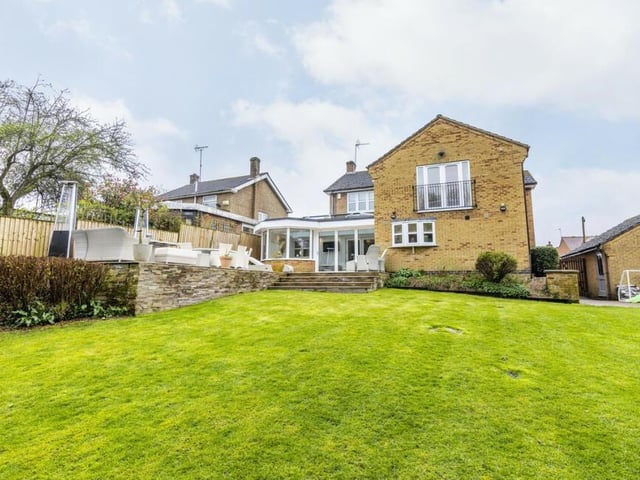 Time to step outside now, and this photo shows the rear of the property. You can see the orangery and the Juliet balcony to the master bedroom.
