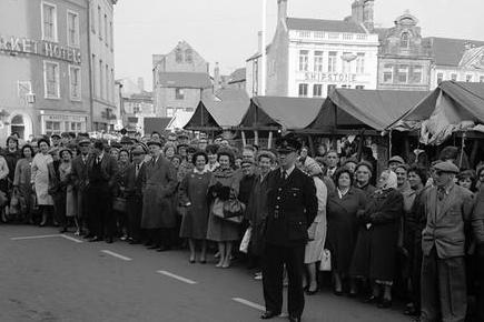 Mansfield folk gather in the market place waiting for the General Election result in 1964.