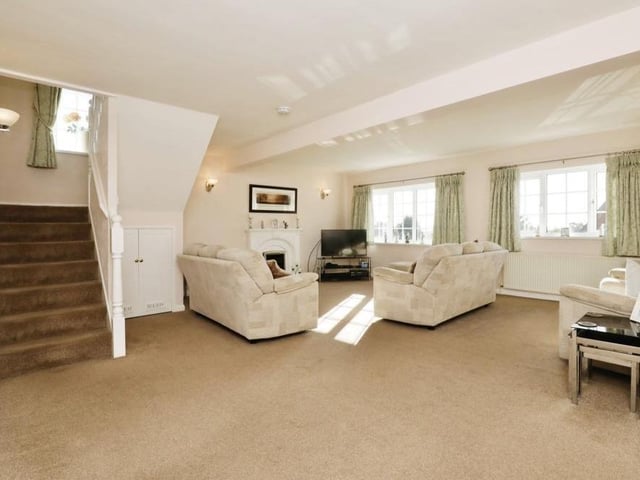 The spacious lounge is the main reception room at the Whitwell property. The focal point is an electric fire with modern surround, while two front-facing, double-glazed windows allow plenty of natural light into the room.