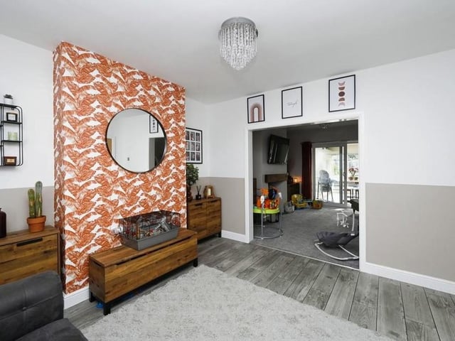 A second shot of the first reception room shows how it seamlessly extends, via open plan, into the second one, offering double comfort!