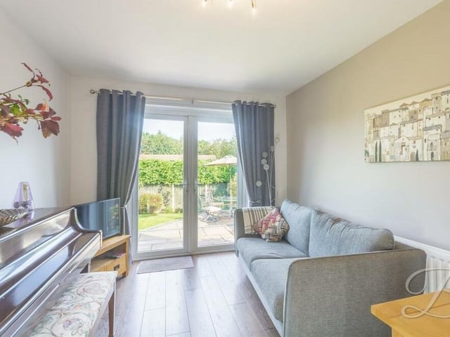 At one end of the dining room are French doors that lead out to the garden.