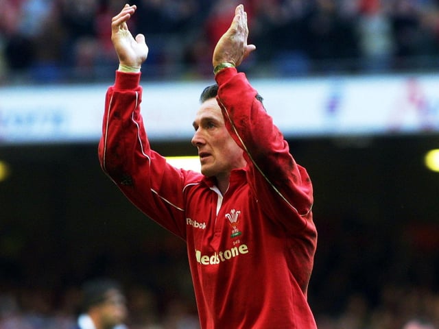 Rob Howley takes the applause of the supporters as he leaves the field in the 66th minute of what was his final appearance for Wales. The scrum-half won 59 Welsh caps and two for the British and Irish Lions.