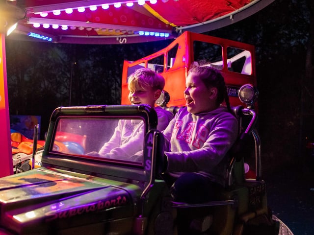 Thomas and Isla, both year 5, enjoy a traditional merry-go-round