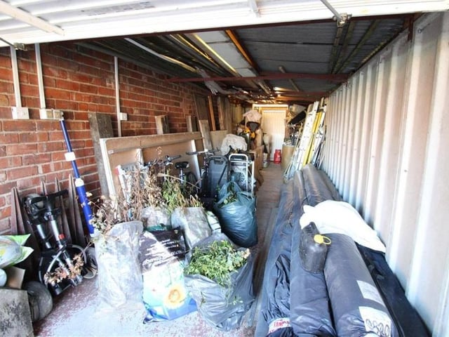 The sizeable tandem garage, at the side of the bungalow, can be used for a variety of reasons, including storage. It has power and lighting.