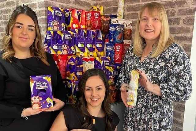 Alanya (centre) with salon owner Hayley Wood (right) and employee Beth McLane after Wood's Of Westgate had collected more than 100 Easter eggs for patients at King's Mill Hospital in Sutton.