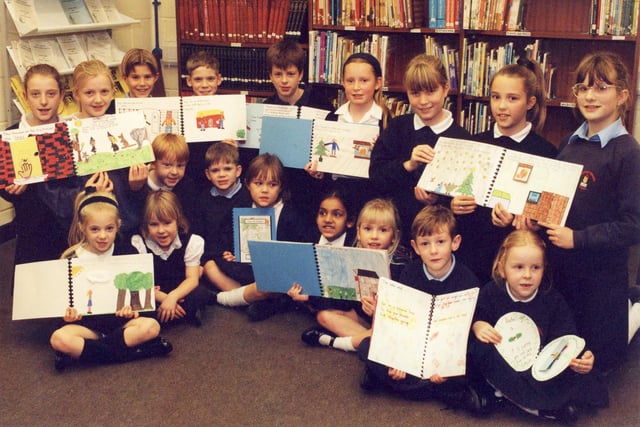 Mortimer Primary schoolchildren show off their home-made books in January 1995. Who can tell us more about the work they did?