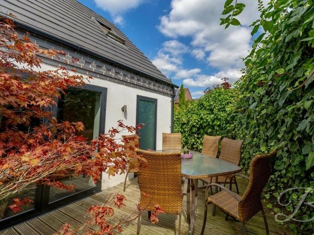This leafy corner of the garden is a delightful spot to spend relaxing with a cup of coffee or glass of wine.