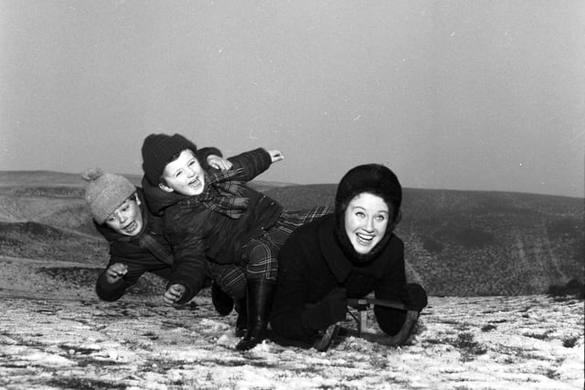 Elizabeth Larner sledging with her two sons at Braid Hills in 1966.