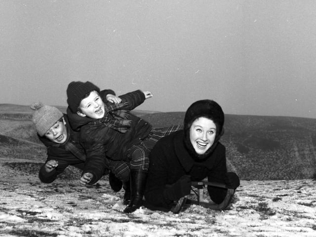 Elizabeth Larner sledging with her two sons at Braid Hills in 1966.