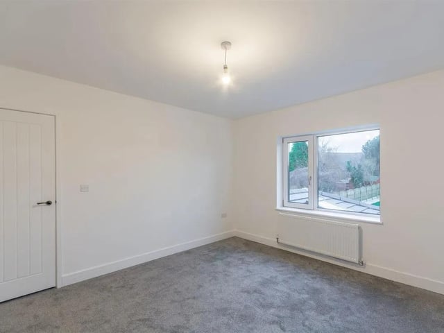 One of six spacious bedrooms