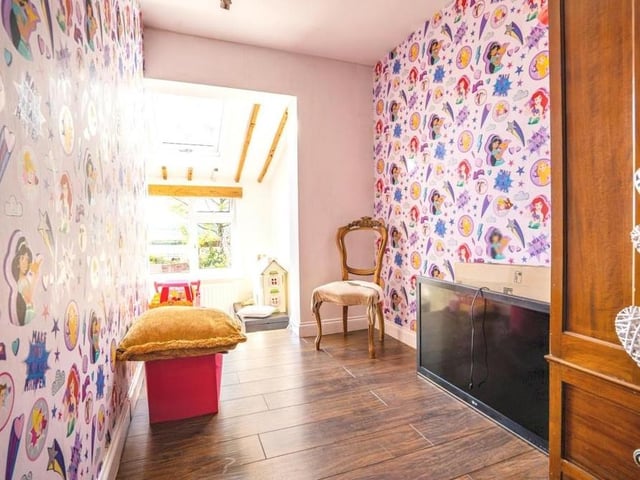 This bedroom is an intriguing one because it sits on two levels with steps down to a lower floor.