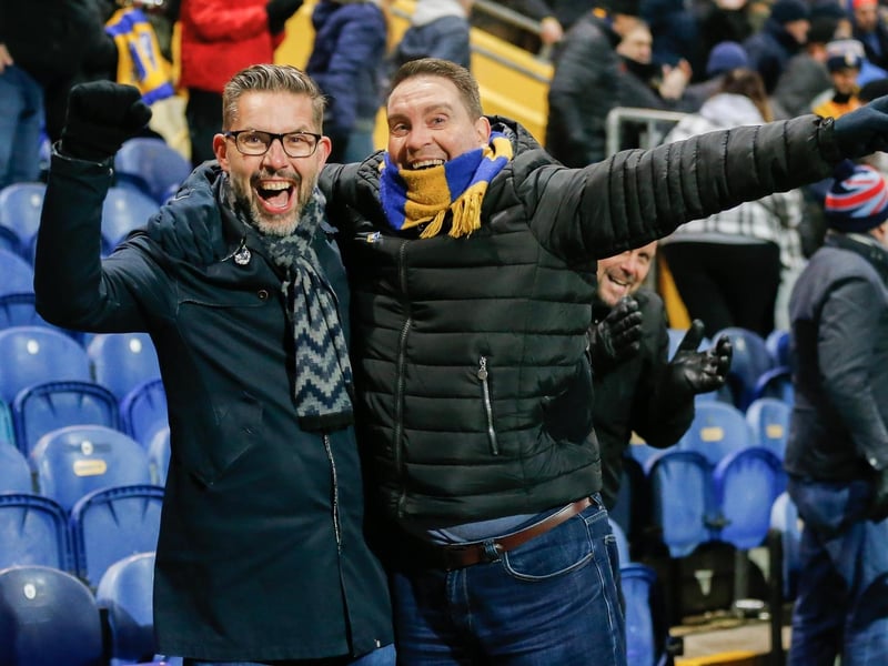 Mansfield Town's faces in the crowd against Swindon Town.