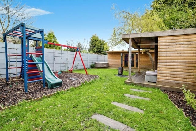 There is even space for some play equipment on a barked area within the busy rear garden.