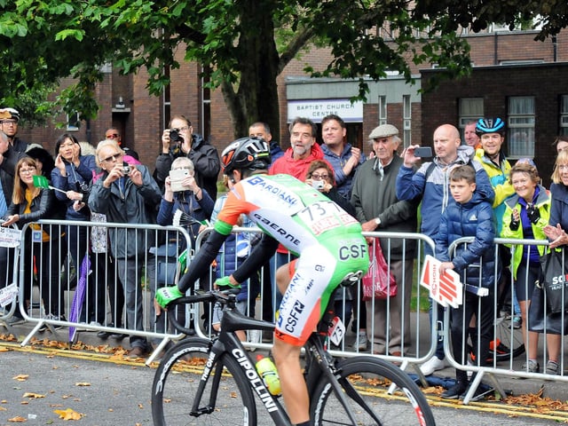 Mansfield fans cheer on the incoming cyclists.