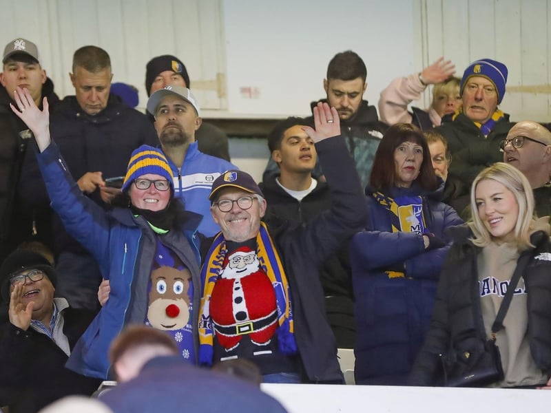 Mansfield Town fans watch the brilliant win at Peterborough United.