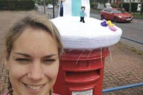Vicki Picton with the post box topper in Rainworth.