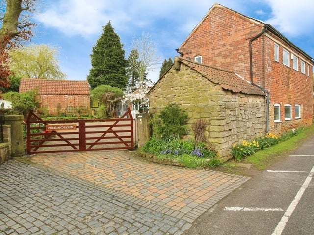 The last image of our gallery shows the electric gated access to the house. Behind the gates is plenty of off-street parking space.