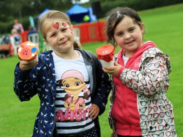 Evie Parkes and Francesca Tudor with their Tour of Britain shakers they made at the 2017 Mansfield Summer Festival at King George V Park.