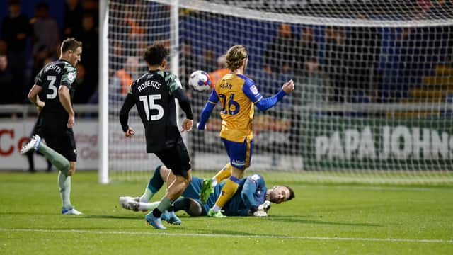 Will Swan has an early shot saved by Scott Loach.