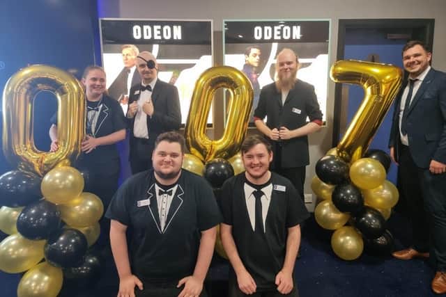 Manager Nathan Hannah and his staff sport their best tuxedos for the opening of the latest James Bond film at Mansfield's Odeon Cinema.