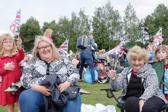 Mansfield's Jubilee Proms And Picnic In The Park event attracted visitors of all ages, including this family, who were delighted to wave the flag for the Queen.