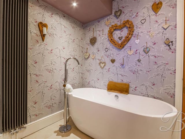 Complete with enclosed shower and freestanding bath.