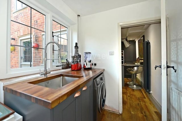 Just off the kitchen diner is this useful utility room that has space for a washing machine. It also boasts a large sink with chrome, extendable mixer tap, ceiling light point, power points, radiator and a door opening on to the back garden.