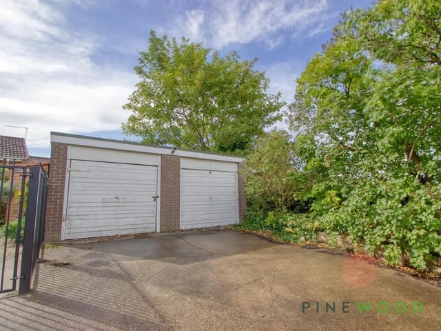 The detached double garage has room for two vehicles or additional storage