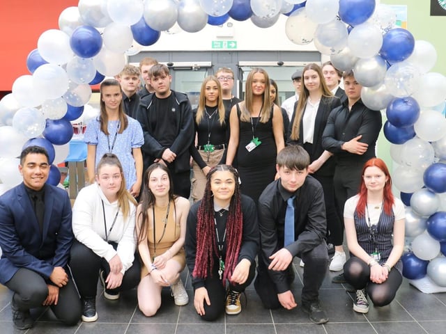 Business students proudly pose at the end of the awards event