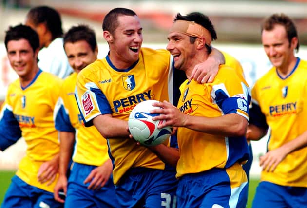 Mansfield Town's Richie Barker celebrates with Danny Reet after getting a hat-trick against Hereford. Picture by Dan Westwell.