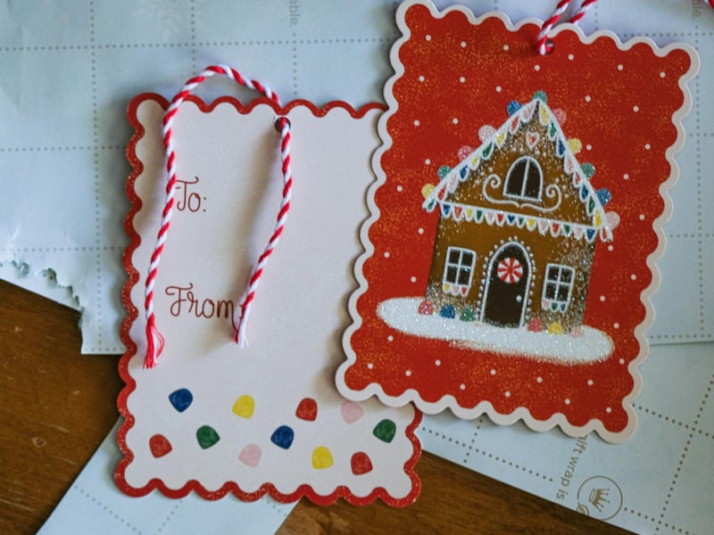 Gift Tags: Making handmade Christmas gift tags is a fun, creative, and personal way to add a special touch to your presents. There are many ways you can create your gift tag:  Using old Christmas cards: Cut around the pieces of the picture you like and stick them onto a small piece of card. Using clementines: Cut a clemantine in half and let it dry overnight. Paint a thin layer of acrylic paint onto the cut side of the fruit and press it onto the cardstock to create a print. Once dry, cut the card into rectangles and write the recipient's name across the print. Lastly, don't forget to put a hole punch in the corner of your tag and tie a bit of ribbon or wool through it to hang it onto your gift.